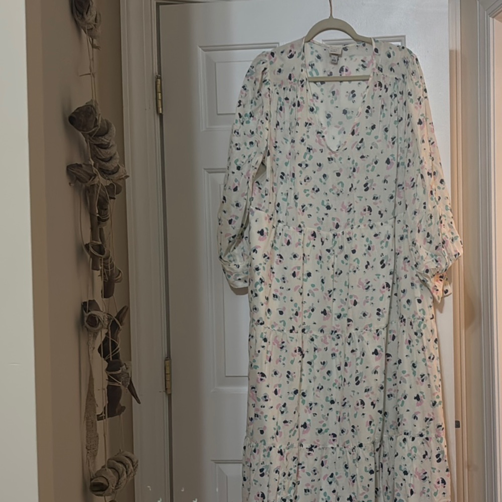 a new day tiered dress , background white, pink, teal, and navy design